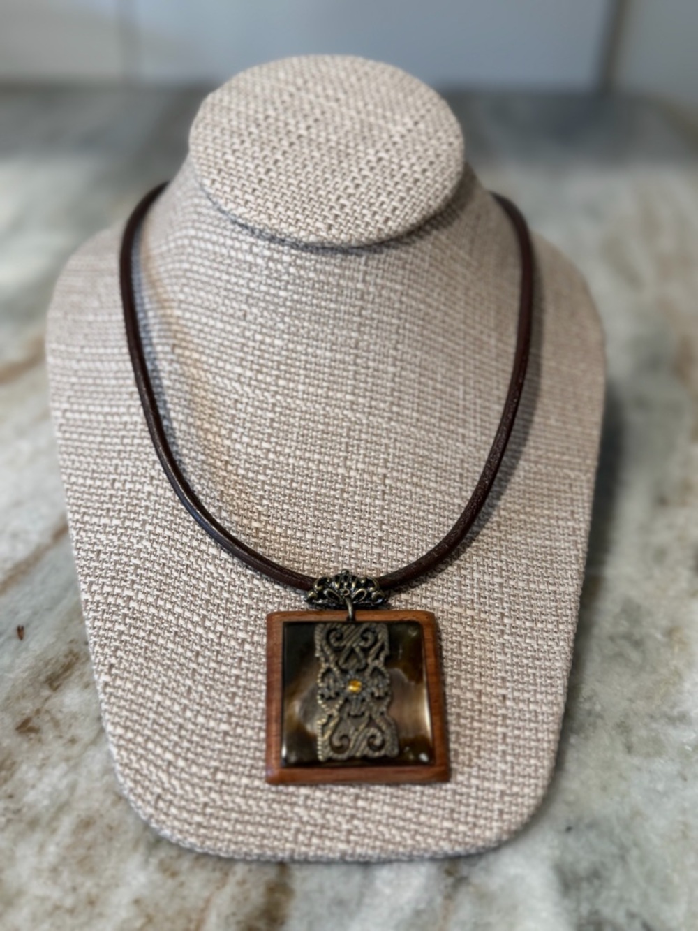 Handcrafted Brown Leather Pendant Necklace with Ornate Metal Accent